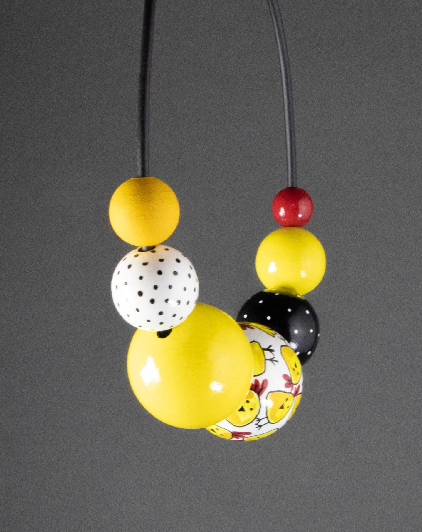 Collana di perline di legno di galline