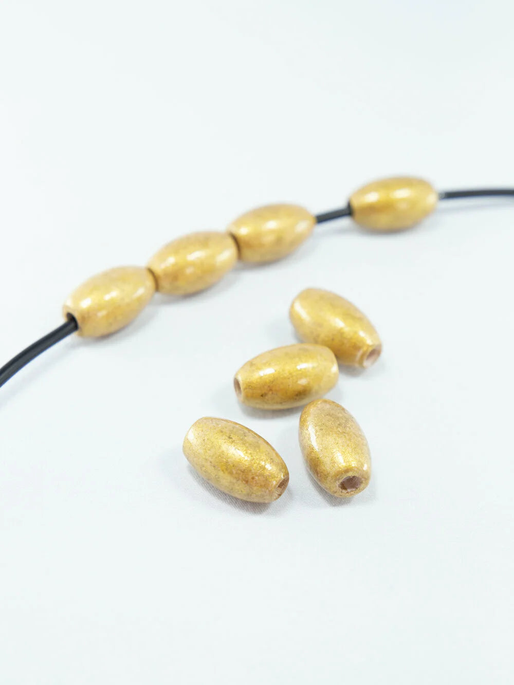 Perline di legno oro antico spazzolato a forma di fagiolo