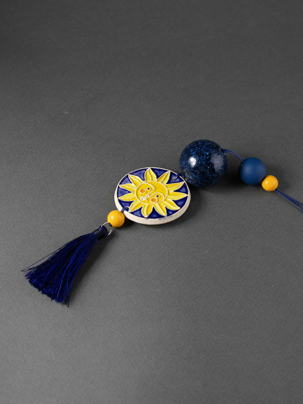 Ciondolo con perline sole